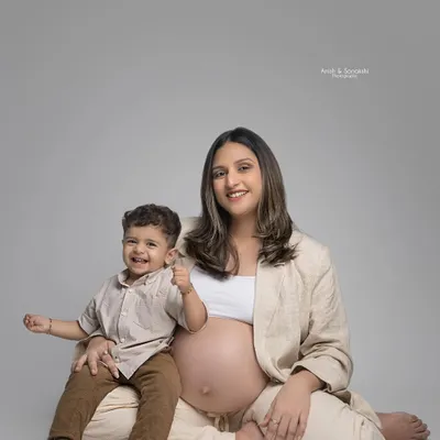 A heartwarming maternity shoot photo with mother and son. I created a very subtle, 'no makeup' makeup look to give the mother to be a natural and radiant glow.