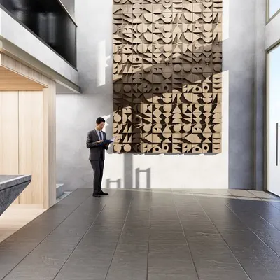 The reception area for the Fratelli office, where a sculpted stone desk and warm wood paneling create a grounded, professional atmosphere. The large-scale wooden art piece serves as a focal point, demonstrating how custom fixtures can define a brand's identity.
