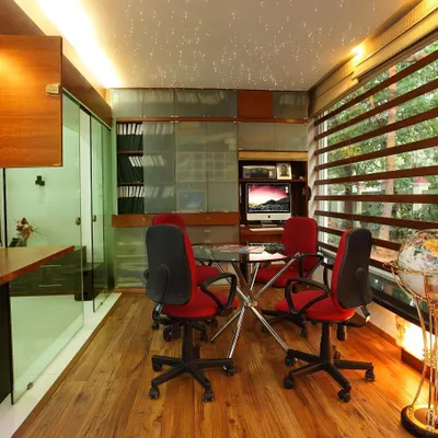As part of the 'Zingy Home' renovation, we reclaimed an unused balcony to create this functional home office. Enclosed with glass and wood, it provides a dedicated workspace flooded with natural light without sacrificing the feeling of openness.