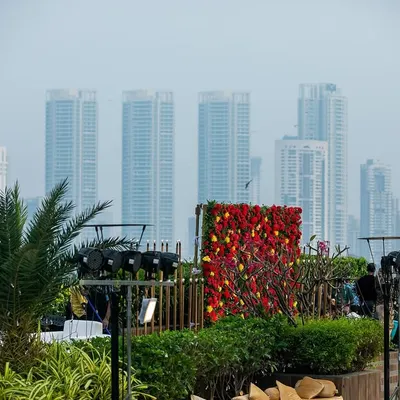 A floral photo booth set against the impressive Mumbai skyline at Jade Gardens. This image shows how we can create picturesque moments by blending our decor with the venue's unique views, perfect for memorable corporate events.