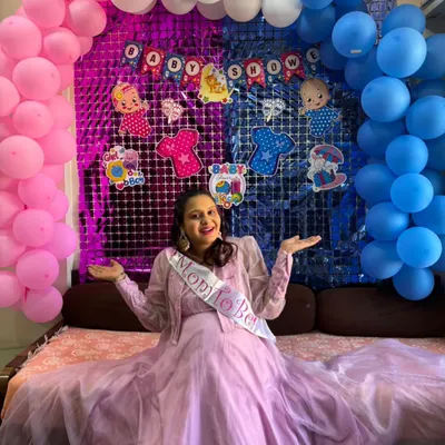 The perfect dress for a gender reveal party. This client is wearing our lavender gown and a "Mom to Be" sash, ready to celebrate the big news.