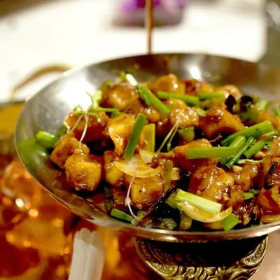 A classic dish from Tangra, Kolkata's Chinatown, served in a traditional kadai. We specialize in bringing authentic regional Indian-Chinese flavors to your wedding menu.