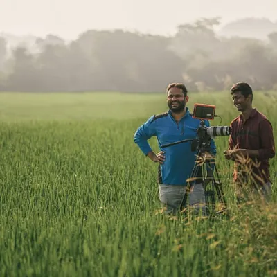 Here I am on World Photography Day, out in a field with my camera setup. This is where I'm happiest, collaborating with other creators and finding the perfect shot in the middle of nature.