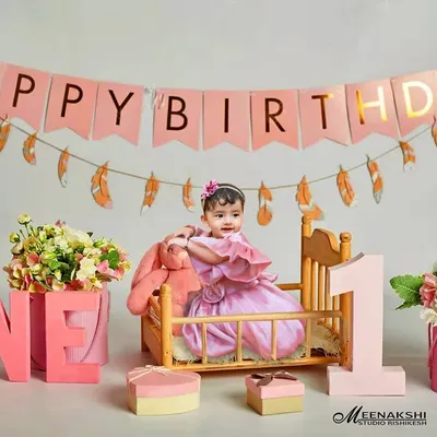 A first birthday is a huge milestone, and I love creating vibrant, celebratory scenes like this one. This setup features a 'Happy Birthday' banner, floral arrangements, and custom 'ONE' blocks, all themed in pink for this little girl's special day.