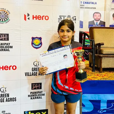 Prisha Agarwal with her Bronze medal and certificate from the Haryana State Ranking Table Tennis Championship. Her consistent performance at the state level is a result of her discipline and commitment to our advanced youth training.