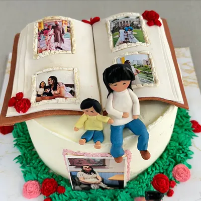 I believe every cake tells a story. This special 40th birthday cake was designed as a photo album, featuring edible pictures of cherished family memories and handmade figures of a mother and her children.