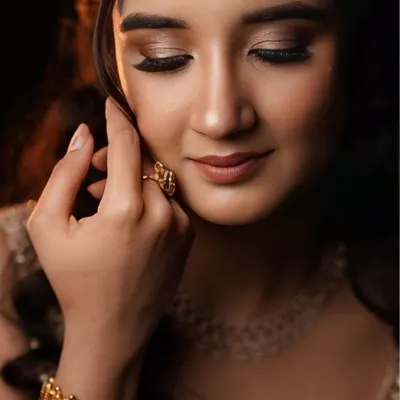 A soft and dreamy look perfect for an engagement or pre-wedding photoshoot. The makeup focuses on a natural glow, with soft waves in the hair.