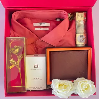 A perfect Valentine's gift for him. This hamper includes a Jack & Jones shirt, a leather wallet, The Man Company perfume, and a golden rose.