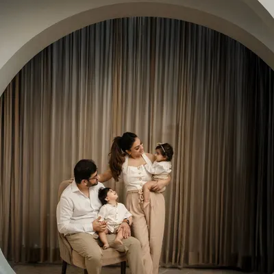 A perfect family portrait in my studio. I love the way they are looking at each other, creating a frame filled with love and connection. The neutral tones keep the focus right where it belongs: on the family.
