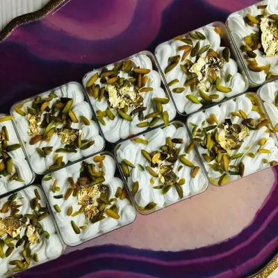 These are my Kesar Pista Tres Leches Cups, made specially for Rakhi. Each cup has a moist, saffron-infused sponge soaked in rich milk and topped with pistachios and edible gold leaf.