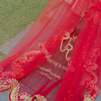 Your story is in the details. For this bride, I helped design a personalized veil embroidered with a meaningful Sanskrit verse and their wedding date, a bespoke touch that weaves their personal saga directly into the fabric of their day.