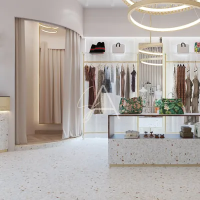A wide view of the 'Beige Bag' boutique, showing the central display counter and elegant ring chandeliers. We used terrazzo flooring and backlit clothing racks to create a bright, inviting, and high-end retail experience.