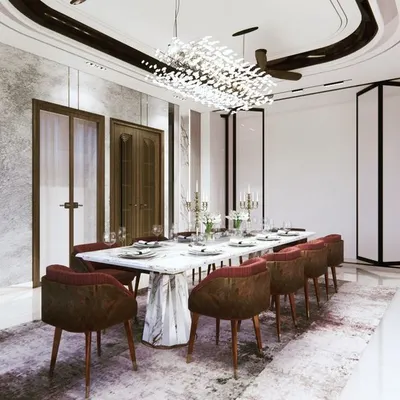 A dining room designed for abundance and connection. The spacious layout, luxurious marble table, and brilliant chandelier are not just aesthetic choices; they are Vastu elements intended to foster prosperity and harmonious family gatherings.