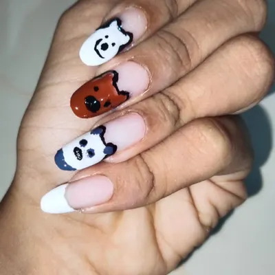 If you have a favorite cartoon, I can paint it. This client wanted a 'We Bare Bears' theme, so I hand-painted Ice Bear, Grizz, and Panda on different nails. This is a fun example of custom character art on gel extensions with a French tip base.