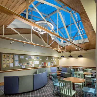 By introducing a large skylight and removing partitions, we turned a cramped attic into an expansive, light-filled learning space. This project at Woodstock School shows how bold interventions can respect a building's history while adapting it for 21st-century needs.