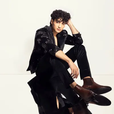 For this men's fashion shoot, I focused on defining his features with subtle contouring and grooming his curly hair to create a polished yet natural look.