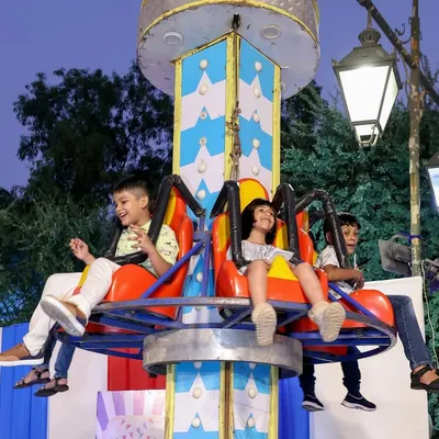 Pure joy on the spinning ride! I provide a variety of kid-friendly amusement rides that are always a highlight of any carnival or large-scale community event.