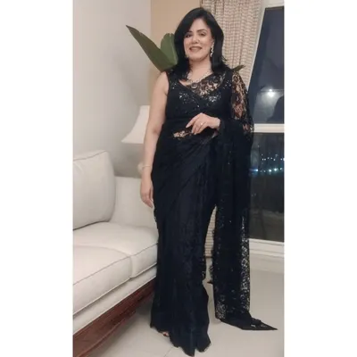 Here is a full-length view of the black Chantilly lace saree I wore for a milestone birthday party. The delicate lace and sequin blouse create a look of timeless elegance, perfect for a formal evening celebration.