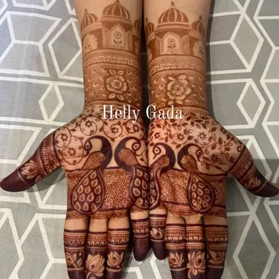 The final henna stain is a mark of tradition and beauty. This peacock design has developed into a rich, dark brown, which is the sign of high-quality, natural henna.