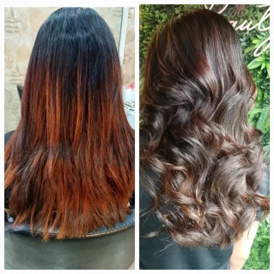 This client's hair was coated with both pre-lightener and henna, creating a challenging canvas. I neutralized the strong copper tones and applied a new base color with highlights using Alfaparf Milano products to achieve this seamless, rich brown result.
