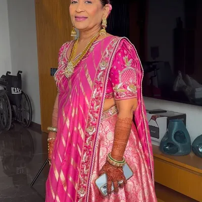 Elegant, sophisticated, and forever beautiful. This look for the mother of the bride focuses on enhancing her natural grace with soft, flattering makeup that complements her stunning pink outfit.