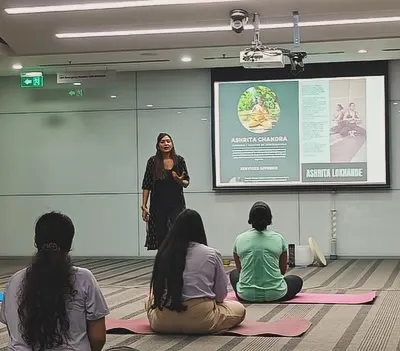 A session begins with settling in. Here, I am guiding the team at ABB Group through a grounding meditation to help them transition from the busyness of their day into a space of mindful presence before we begin our practice.