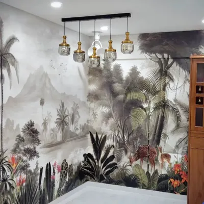 A fully customized jungle mural installed in a Borivali residence. The detailed design wraps around the room, creating an immersive tropical experience right in the dining area.