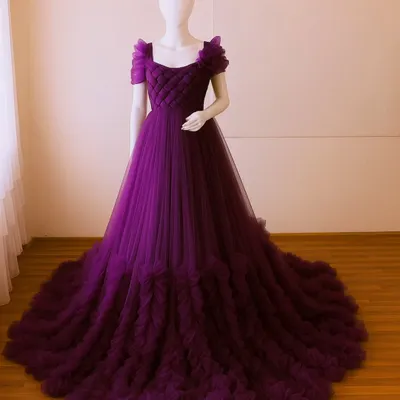 A full view of my popular magenta ruffled gown on a mannequin. This allows you to see the quilted bodice, floral shoulder detail, and the voluminous tiered train.