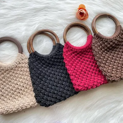A collection of my popular wooden handle bags, available in a wide range of colors. Here you can see them in versatile beige, classic black, bold red, and earthy brown.