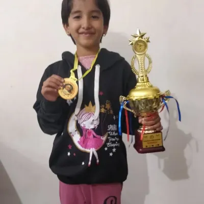 It all starts here. Our U-6 champion Krisha, holding her first big trophy. We focus on making early competitions positive and exciting to build a lifelong love for the game.