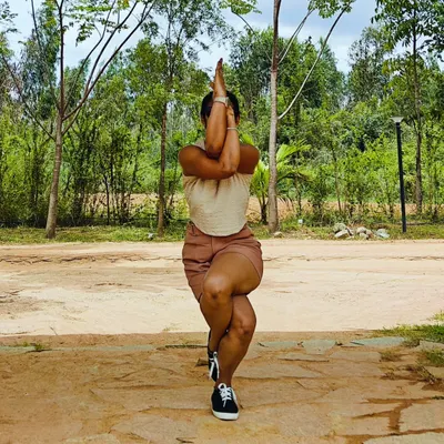 Eagle mode activated. Garudasana, or Eagle Pose, is a powerful standing balance that improves coordination and opens the shoulders and hips. Here I am finding my focus and strength among the trees.