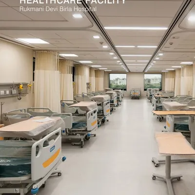 This is a ward at the Rukmani Devi Birla Hospital. The design prioritizes patient comfort and operational efficiency, with ample space between beds, clear circulation paths, and access to natural light from the windows.