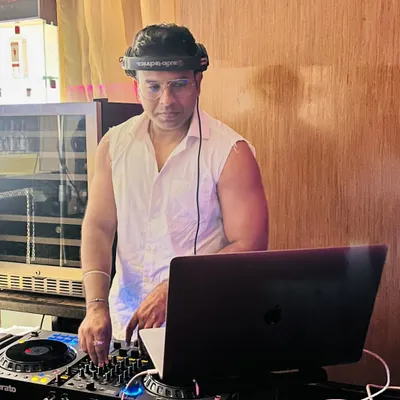 A candid shot of me at the console during a Latin Twist event. The best compliment I can get is when someone tells me they could not stop dancing, and that is the goal for every set I play.