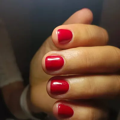 A simple, clean manicure featuring a classic red gel polish on short, natural nails. This minimal glam look is timeless, elegant, and never goes wrong.