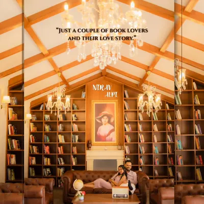 A grand, wide shot of Nirav and Alpi in a beautiful library, perfectly capturing the 'book lovers' theme. This image establishes the scene for their unique and personal pre-wedding story.