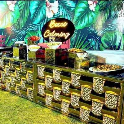 Our custom salad bar with a neon sign, set up for an outdoor event. We provide a variety of fresh vegetables, toppings, and dressings for a healthy and vibrant option.