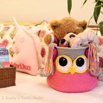 My bestseller, the Owlie Basket, shown here in a child's room filled with cuddly toys. The big eyes and colourful tassels make tidying up fun.