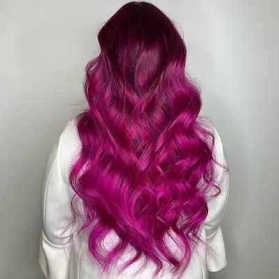 This vibrant magenta pink is for those who are ready to be bold. To achieve this intense hue, the hair needs to be healthy and properly pre-lightened, but the result is a stunning, head-turning color that expresses personality and style.