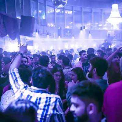 A view of the packed dance floor at Sarjapur Social. The place was filled with smoke and lights, creating an immersive party experience.