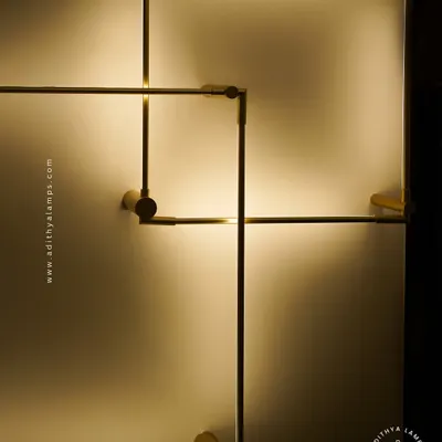 A closer look at our minimalist square LED wall sconces. The slim gold-finished frame emits a soft backlight, creating a halo effect on the wall. These can be arranged in overlapping patterns for a custom art installation.