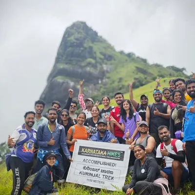 Our group at the summit of Kurinjal Trek, holding our banner high. Another peak conquered!