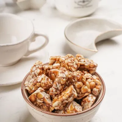 Here is my crunchy, fresh Peanut Chikki, a perfect fix for your sweet tooth. Made with roasted peanuts and jaggery, it's a nostalgic treat that brings back fond memories.