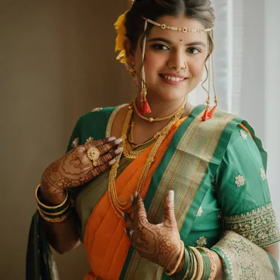 A classic Maharashtrian bridal look, featuring a beautiful nauvari saree. We created a natural, elegant makeup style to let her joyful spirit shine through.