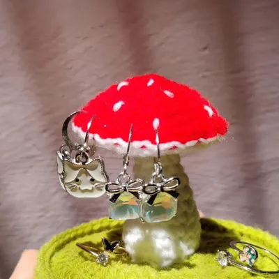My crochet mushroom jewelry holder is a whimsical way to organize your accessories. The mushroom cap is perfect for hanging earrings, while the base can hold rings and other small trinkets.