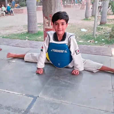 This young student shows incredible flexibility with a perfect center split. This is a foundational skill we develop in all our athletes from a young age.