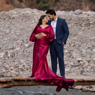 This wine-red fishtail gown is one of my most requested pieces for pre-wedding shoots. The dramatic train and satin fabric create a stunning silhouette against any backdrop.