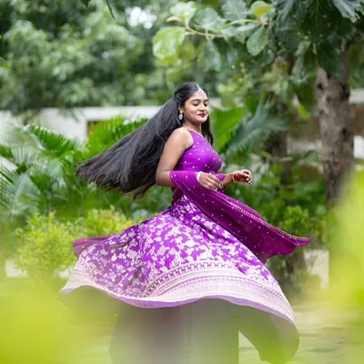 The perfect twirl in her custom purple Banarasi lehenga. The movement of the skirt shows off the rich fabric and intricate silver work.