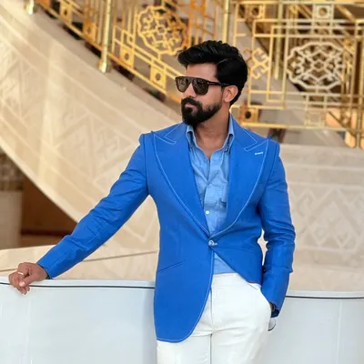 Our vibrant blue linen blazer with wide lapels and prominent white stitching. It's a fresh, modern piece perfect for day events, brunches, or a stylish resort vacation.