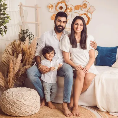 A beautiful family portrait in our boho-themed studio setup. The natural textures and warm tones create a relaxed and inviting atmosphere for your photoshoot.
