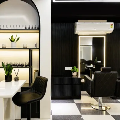 In a salon, elegance must meet function. This manicure station features a striking arch backdrop to display nail colors, creating a playful yet sophisticated focal point. The design balances symmetry and clean lines for a calm, captivating oasis.